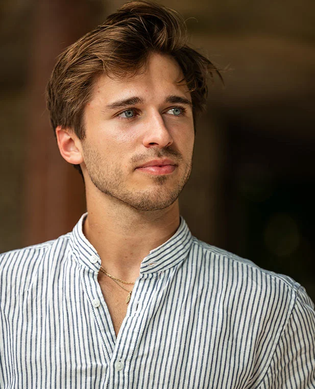 A three-quarter portrait of a man looking off-camera, highlighting the symmetry and restored shape of the ear following an earlobe revision procedure.