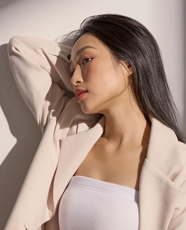 A profile portrait of a woman with smooth, healthy-looking skin, representing the skin-rejuvenating effects of professional microneedling.